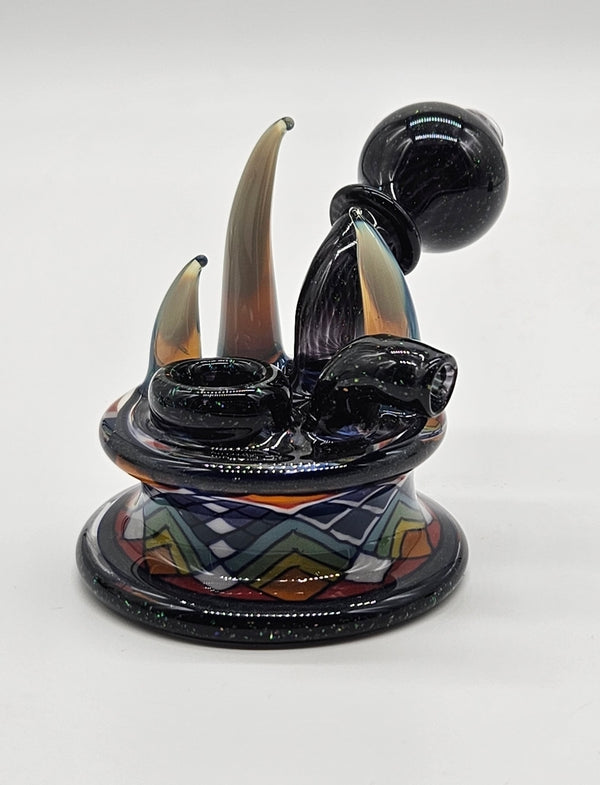 Freeekglass crushed opal dry hammer — studio shot, horns and patterned base.